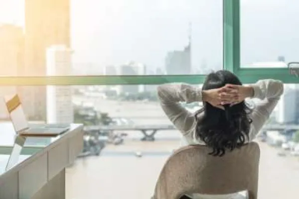 a woman relaxed looking out a window