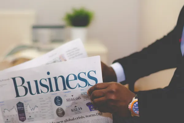 a business person reading a newspaper