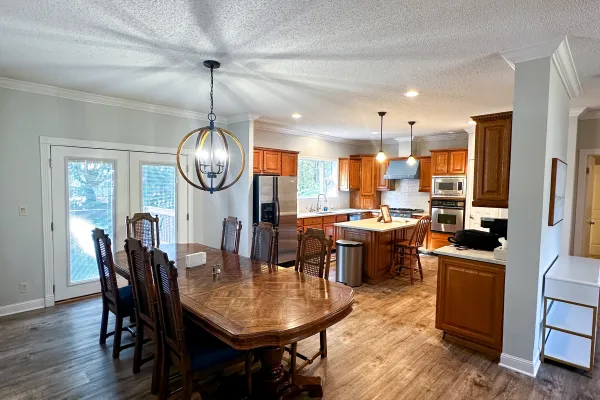 a large kitchen with a dining table