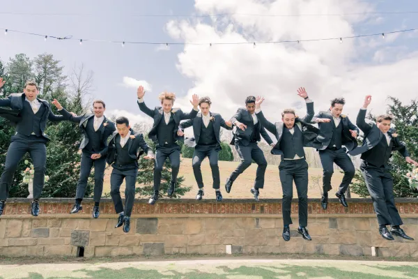 a group of men jumping in the air
