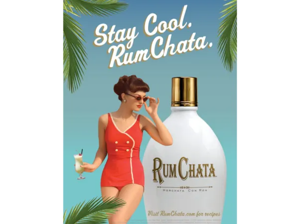 rumchata print magazine advertisement showing woman holding a cocktail surrounded by palm trees