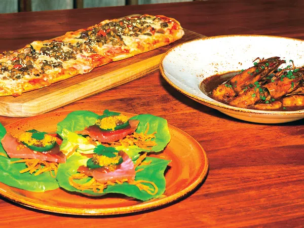 pizzas on plates on a table