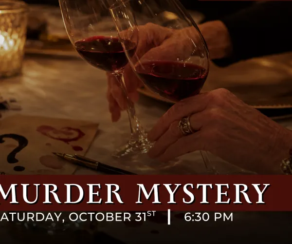 Two hands clinking wine glasses over a table with mysterious notes and dim candlelight ambiance