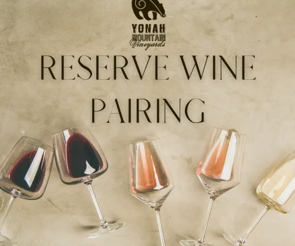 Yonah Mountain Vineyards reserve wine pairing with red, rosé, and white wines in glasses on beige background.