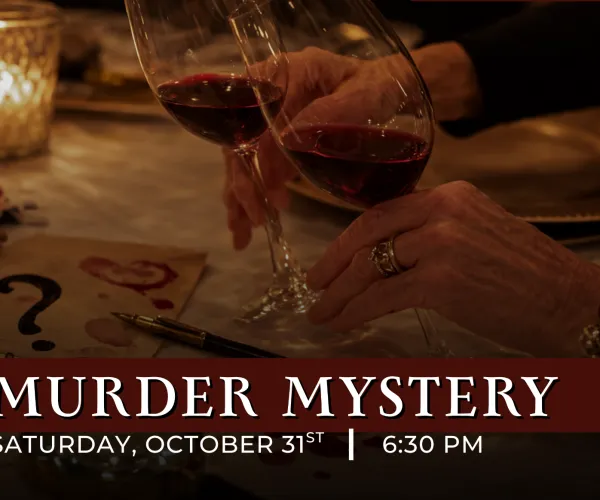 Two hands clinking wine glasses over a table with mysterious notes and dim candlelight ambiance