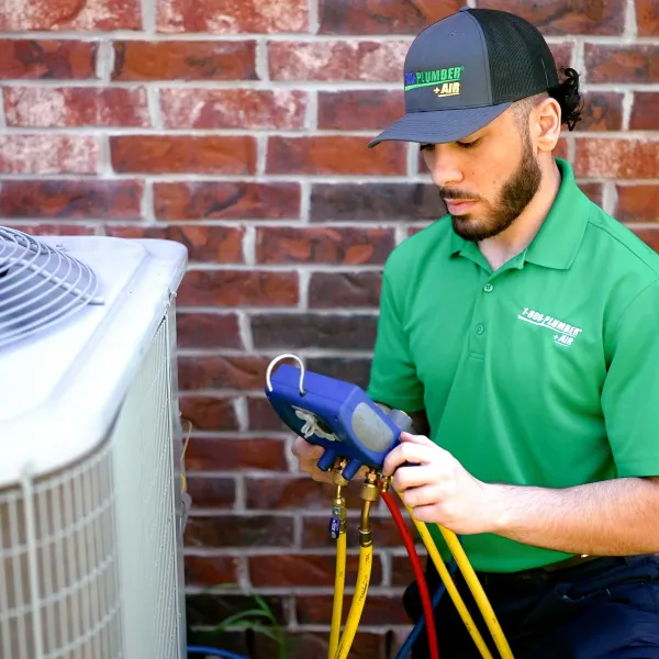 a man working on a ac unit