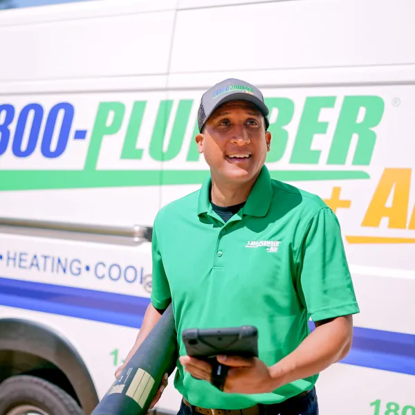 a man working on a water heater