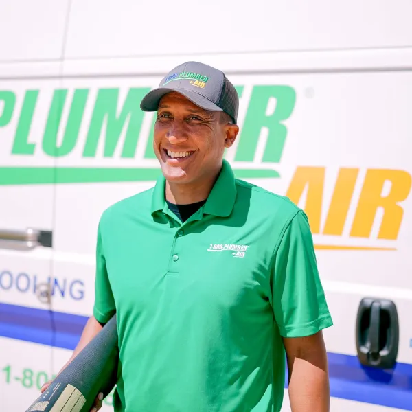 Company standing in front of van