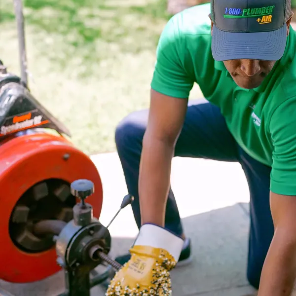 A 1-800-Plumber +Air of Clearwater plumber unclogs a drain