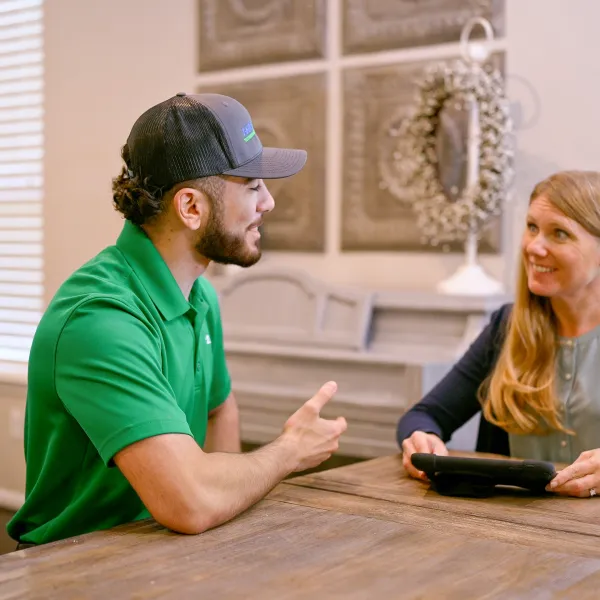 A scottsdale plumber discusses repipes with a homeowner