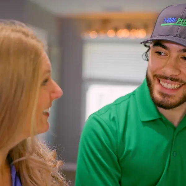 A Houston Plumber and A Woman in a kitchen
