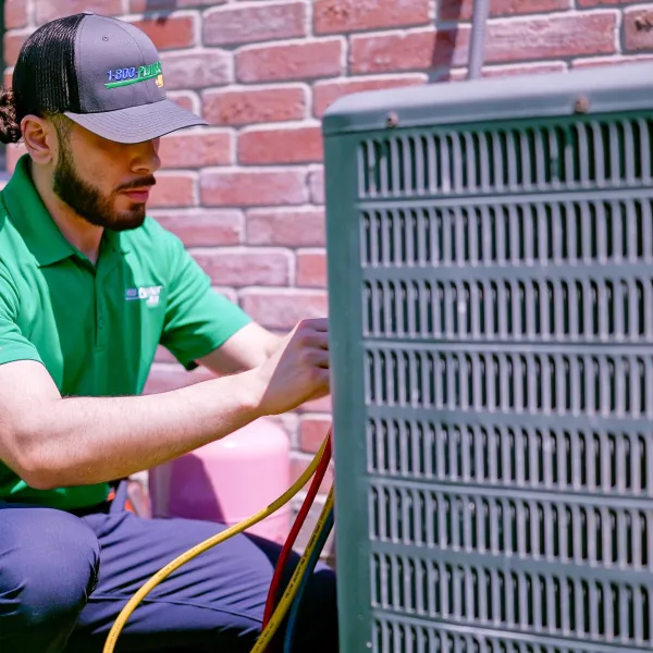 A Clearwater heating technician repairs a furnace