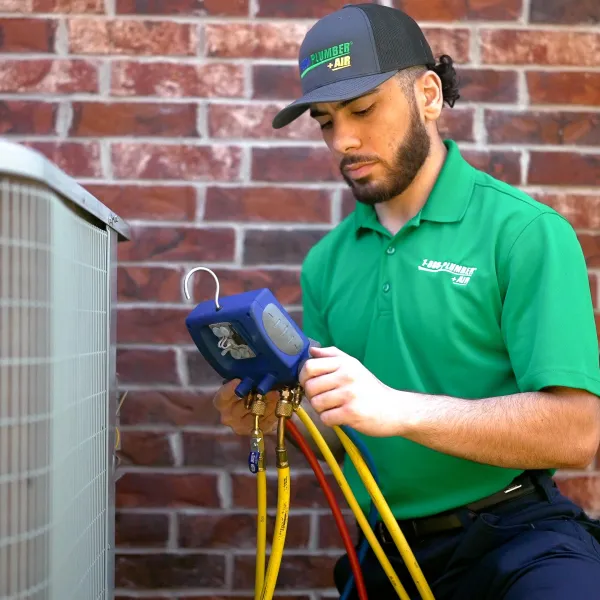 ac technician working on unit