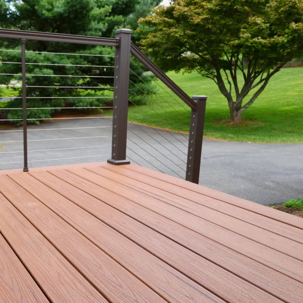 a wood deck with a metal railing