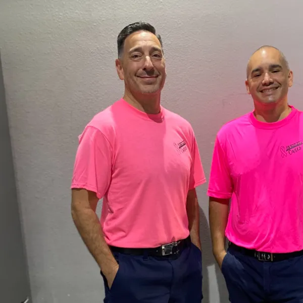 two men standing in a room