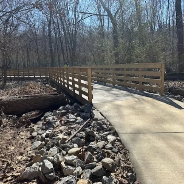 a wooden bridge over a river