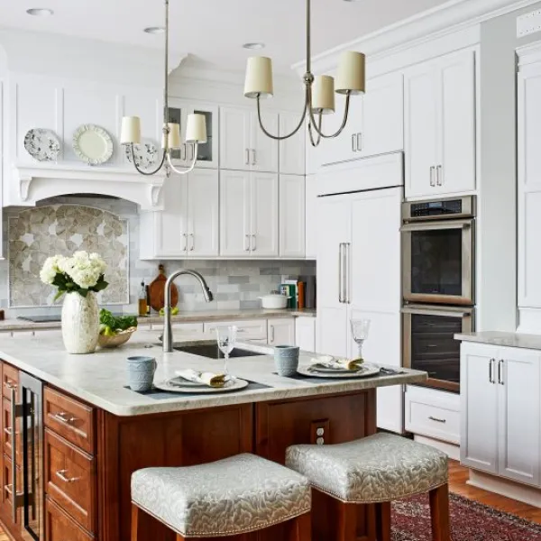 a kitchen with a marble island