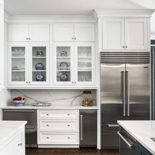 a kitchen with white cabinets