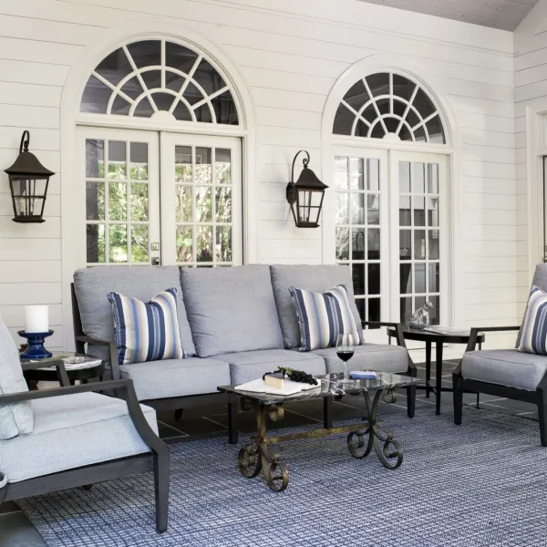 a living room with a couch and chairs