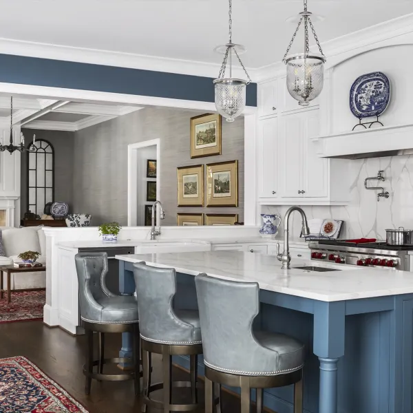 a kitchen with a bar stool and a table