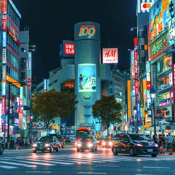 a busy street with many billboards