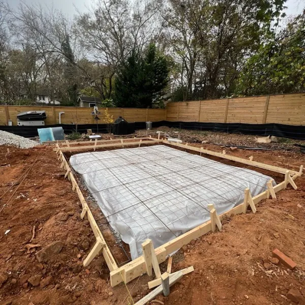 a wooden foundation with a fence