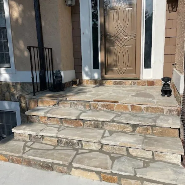 a stone staircase leading to a door