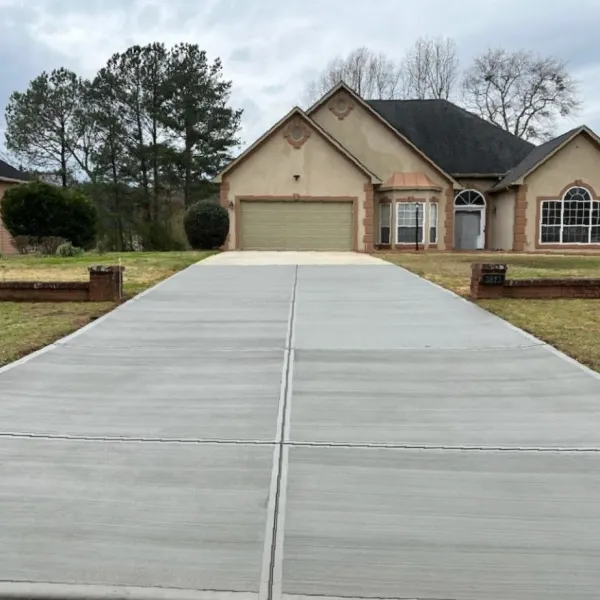 a white rectangular object with a black line on it in front of a house