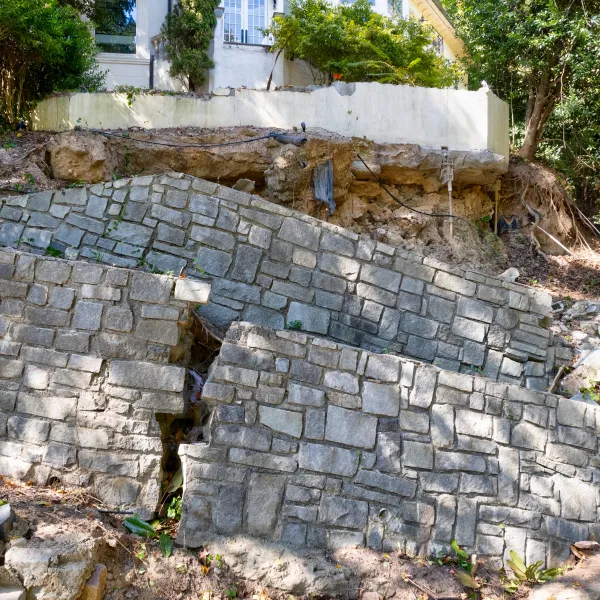 a stone wall with a stone fence