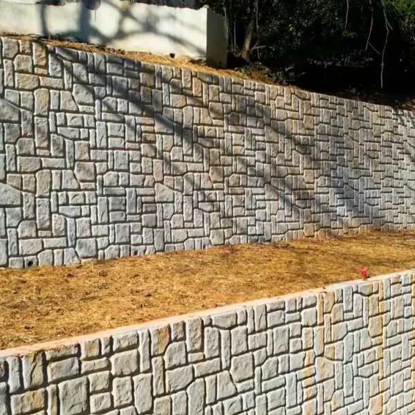 a stone wall with a stone fence