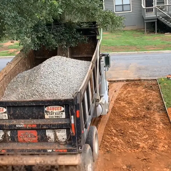 a truck with dirt on the back