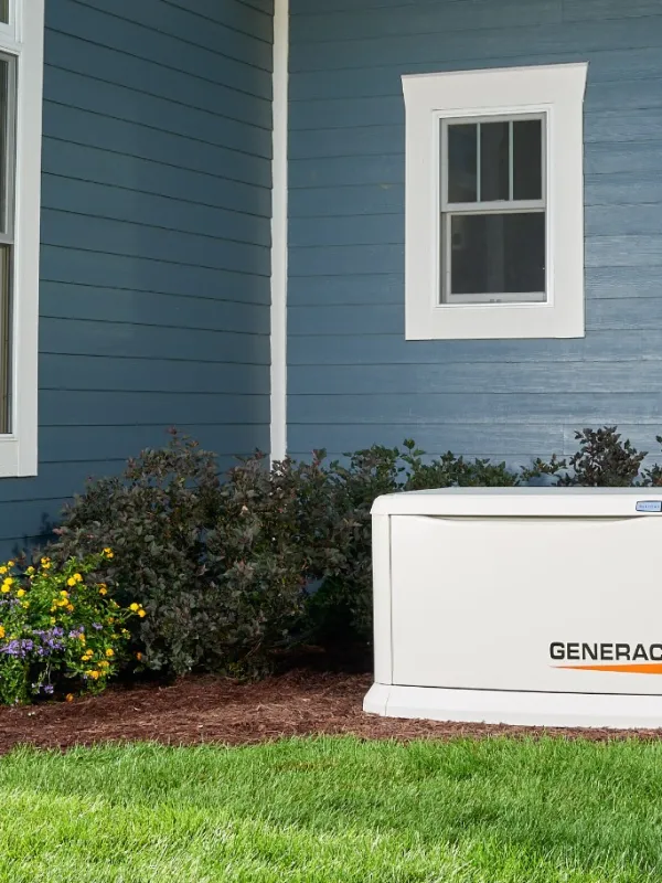 a white refrigerator in front of a house