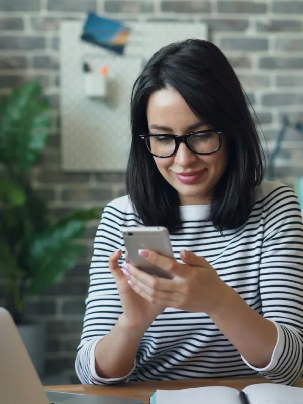 a woman holding a phone