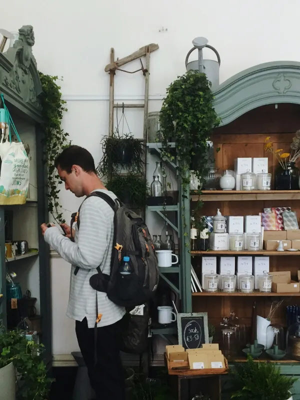 a man standing in front of a store