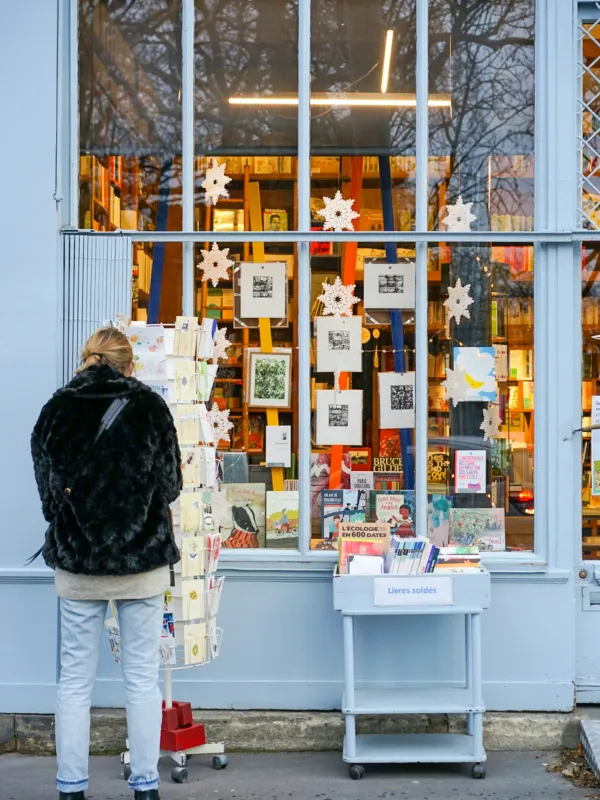 a person looking at a display of books