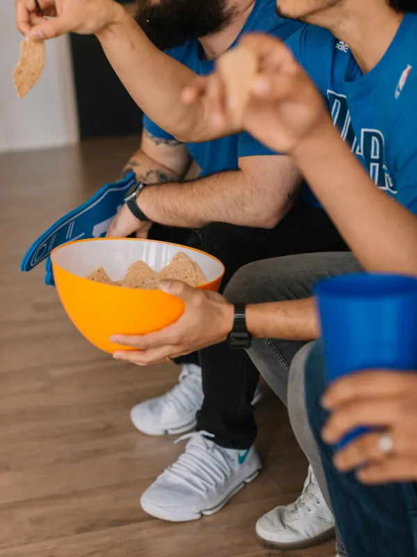 a person holding a bowl of food