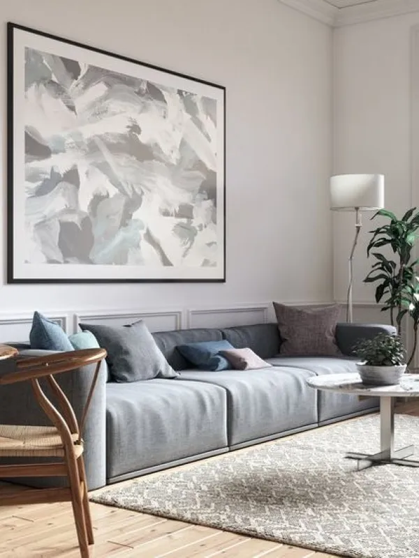 a living room with a couch and chairs