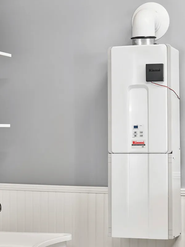 a water heater sitting next to a sink