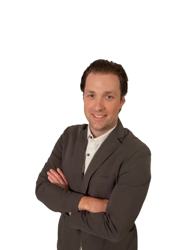 a man in a suit with his arms crossed