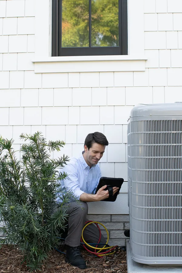 a man sitting on a chair outside