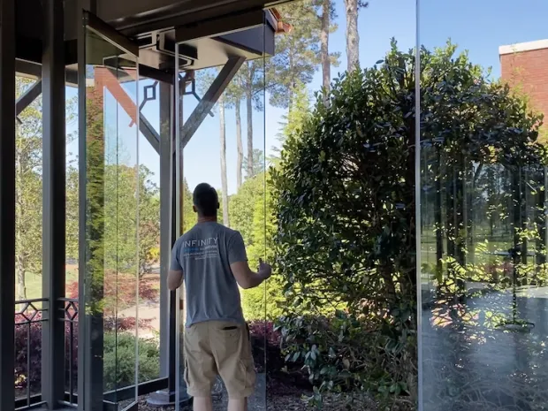 North Georgia Replacement Windows installing Euro-Wall stacking glass patio doors at Atlanta Athletic Club