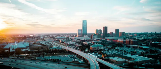 a city landscape with a freeway and buildings