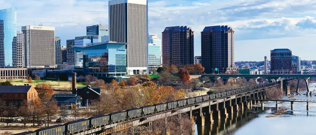 a city skyline with a river