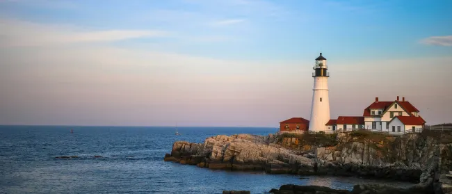 a lighthouse on a rocky island