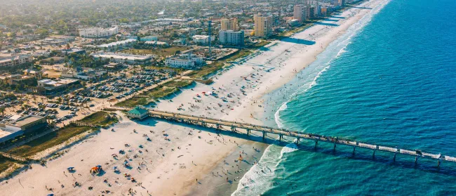 a beach with many people on it