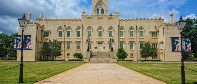 a large building with a brick walkway