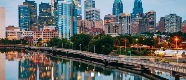 a city skyline with a river