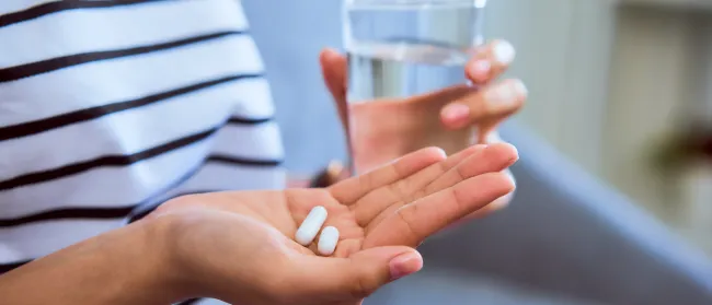 a person holding a glass