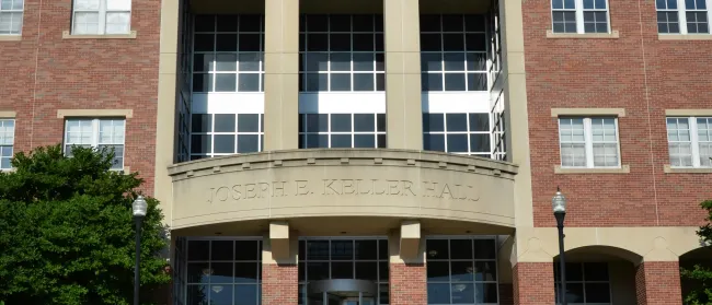 a beach with buildings and water