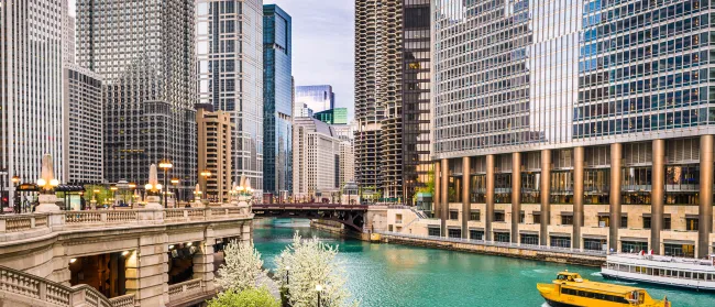 a river with boats in it and buildings around it